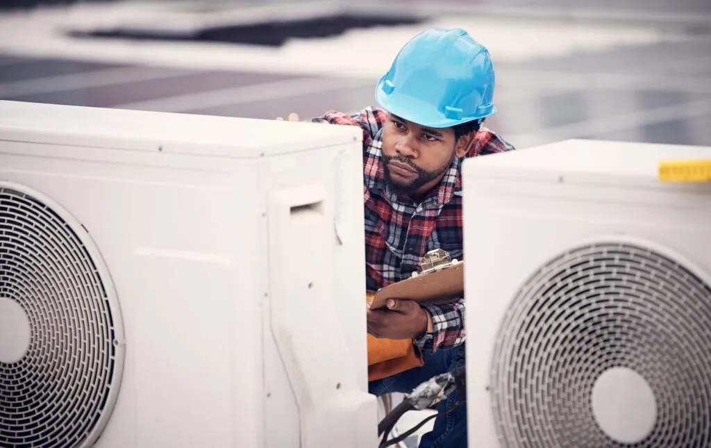 A technician performing HVAC services in Rathdrum, ID